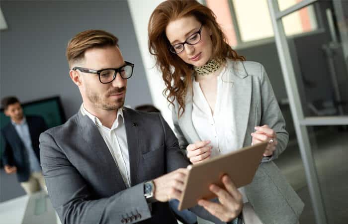 Colleagues looking at tablet